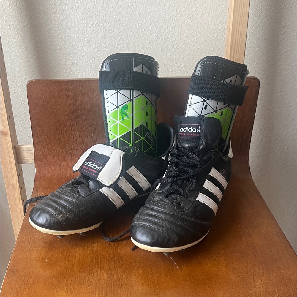 Adidas Black and White Soccer Cleats with Green Shin Guards